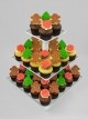 Christmas cupcakes with thematic marshmallow fondant shapes.