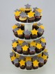 Christmas cupcakes with thematic marshmallow fondant shapes.