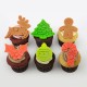 Christmas cupcakes with thematic marshmallow fondant shapes.